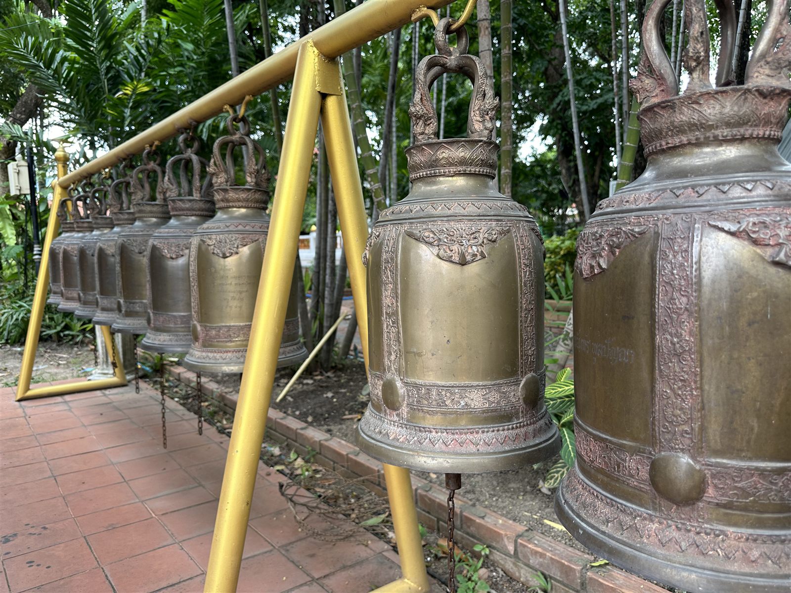 Chiang Mai Temples — a row of bronze bells at Wat Phra Singh