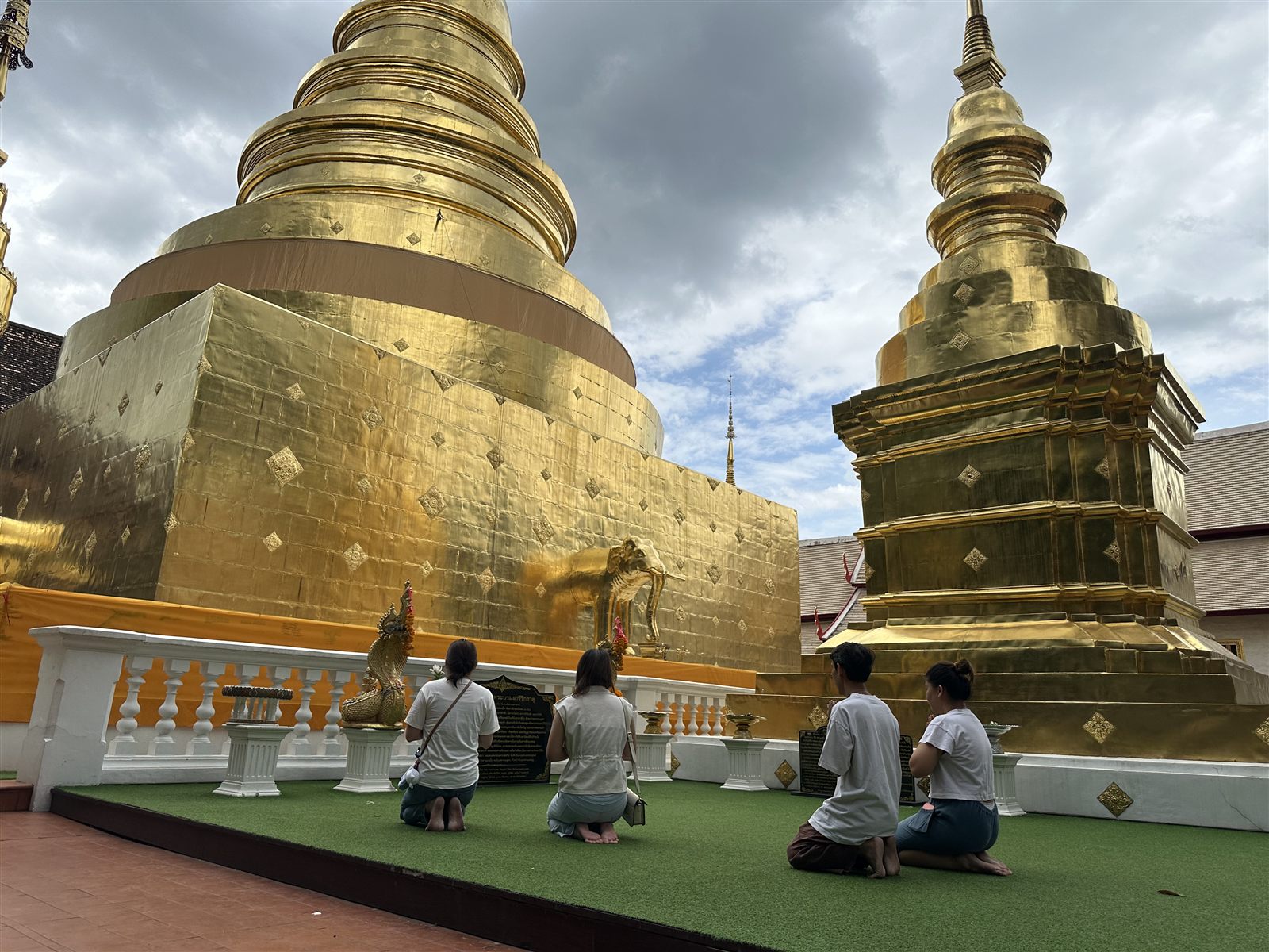 Chiang Mai Temples — paying respects before the golden chedi at Wat Phra Singh